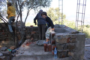 Finn helps with some of the more practical aspects of ...latrine design
