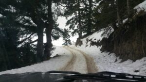 Crossing snowey mountain pistes to Azilan